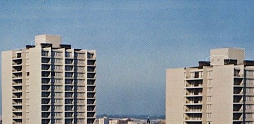 This 60s aerial photo, of HW and HE, shows dark shapes in the penthouse south walls, which proved to be exhaust louvers over elevators 1 and 2 [HW] and 4 and 5 [HE], but which have been filled in with concrete block.
See diagram at top.